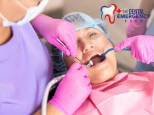 Patient receiving urgent oral care from dental professionals, illustrating response to a Dental Emergency