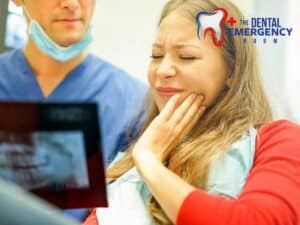 A patient experiencing pain from a Wisdom Tooth, being examined by a dentist.