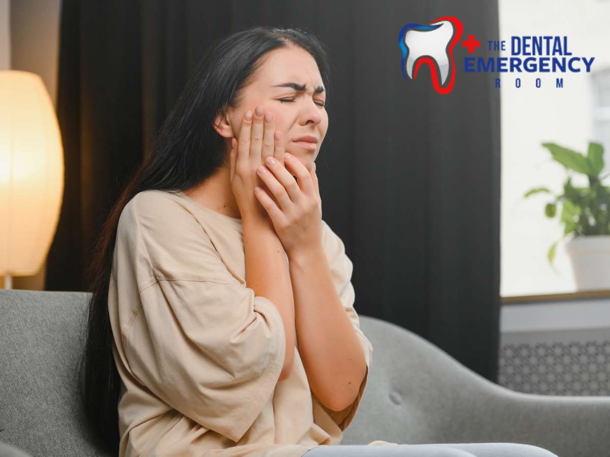 Woman with pained expression holding her cheek, suggestive of a dental abscess