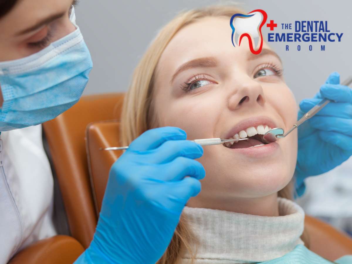 Dentist performing a dental examination before root canal therapy on a smiling female patient at The Dental Emergency Room